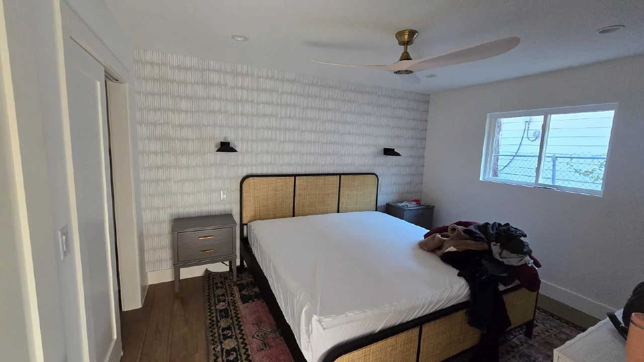 Bedroom installation with grasscloth wallpaper